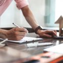 Man creating plans for custom home building