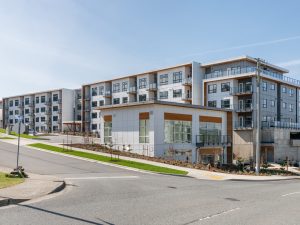 Exterior of Link on Long Lake in Nanaimo, a modern multi-family rental development with balconies and landscaped streetscape.