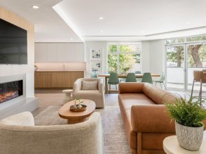 Resident amenity lounge at Melody in Nanaimo, with modern seating, kitchen and dining areas, and large windows.
